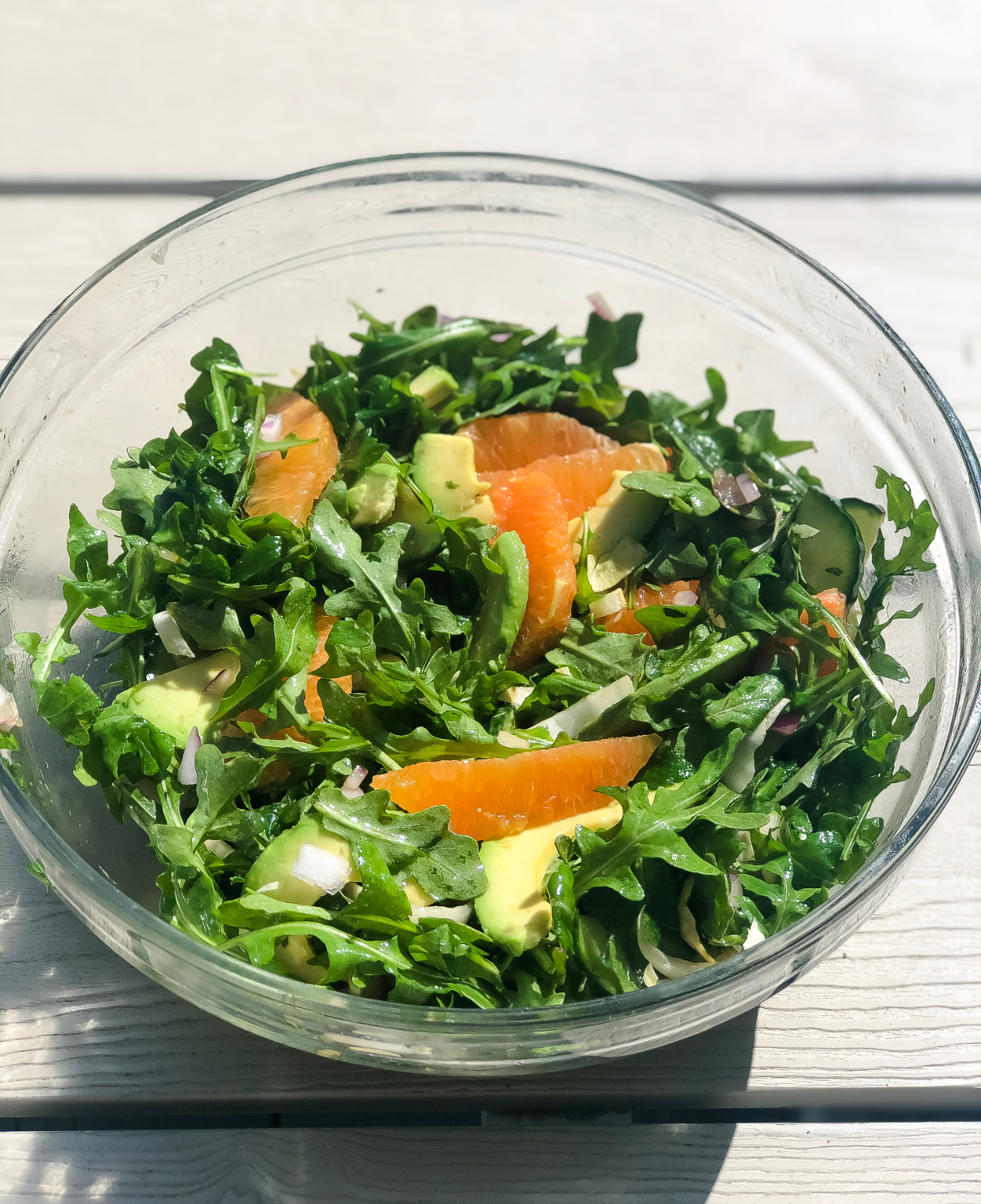The finished arugula side salad with citrus and balsamic vinaigrette