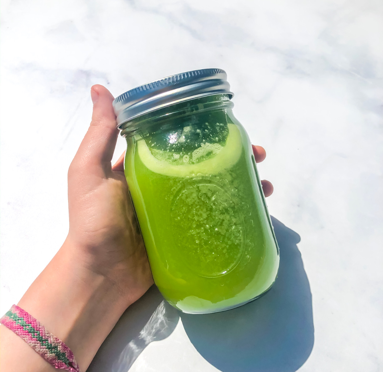 Finished juice in a mason jar for the very best green juice recipe