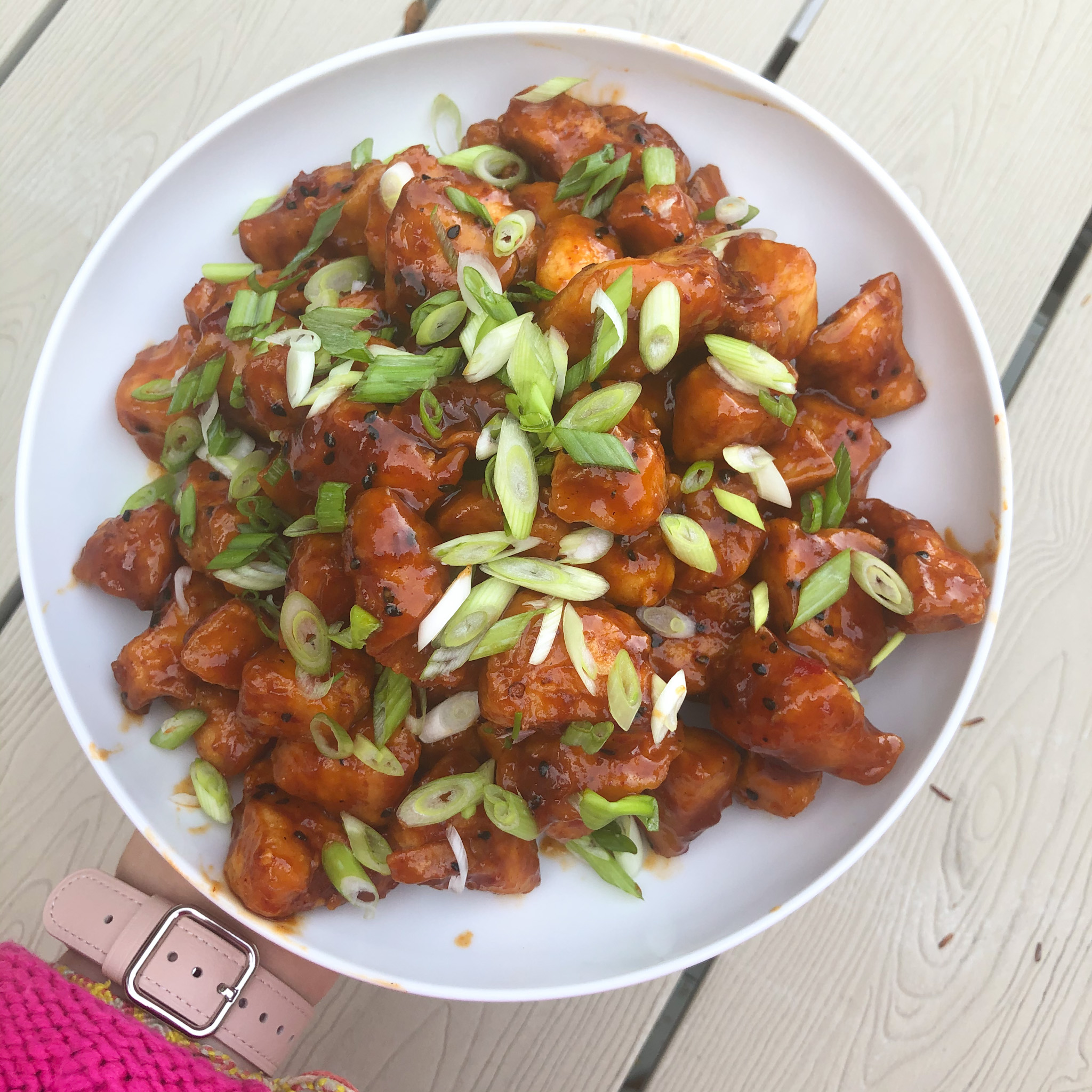 the finished plate of gluten free korean fried chicken with scallions